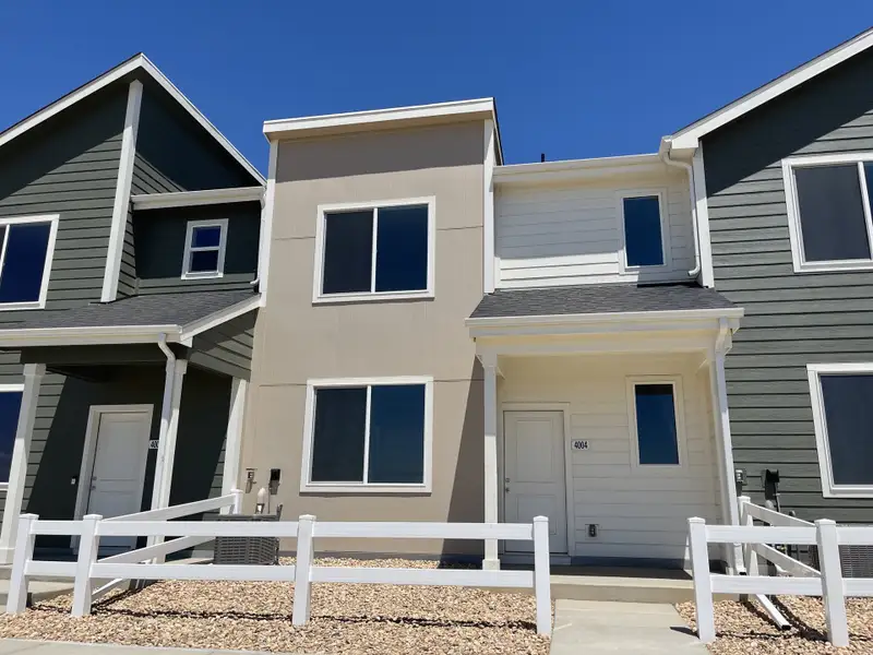 Front exterior of a new home in Liberty Draw, Evans, CO, highlighting curb appeal (Image 2). Front exterior of a new home in Liberty Draw, Evans, CO, highlighting curb appeal (Image 2).