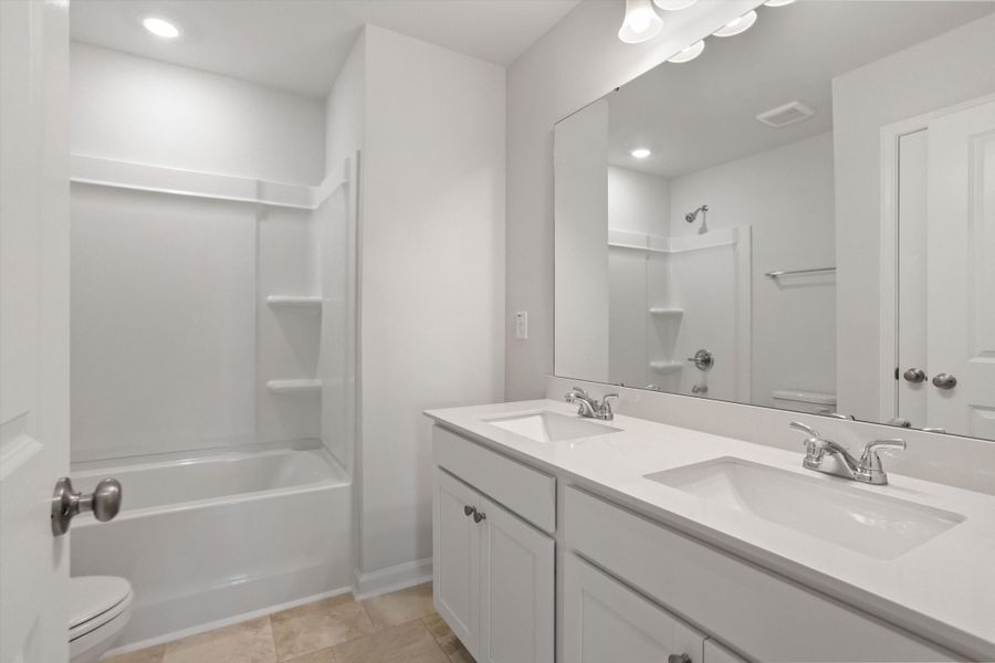 Furnished interior view inside a new home in Cambridge Reserve, Angier (Image 13).