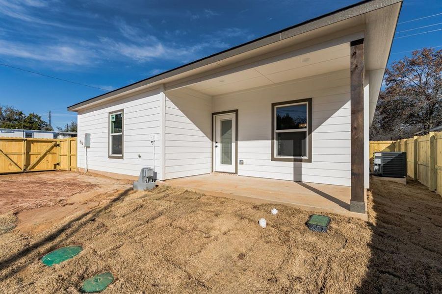 Back of property featuring a patio area and central air condition unit