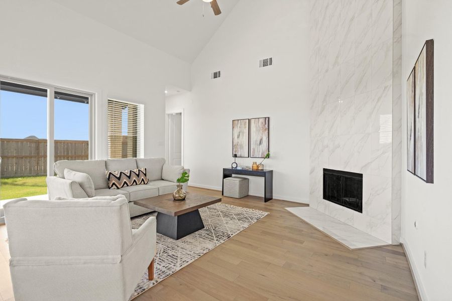 This living room goes beyond just an indoor entertaining space and can be opened up via sliding glass doors to an oversized patio and huge backyard! Talk about the perfect indoor outdoor entertaining space.