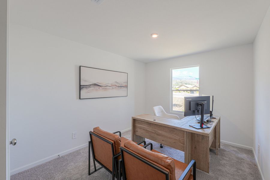 A room with a desk and chairs. A room with a desk and chairs.