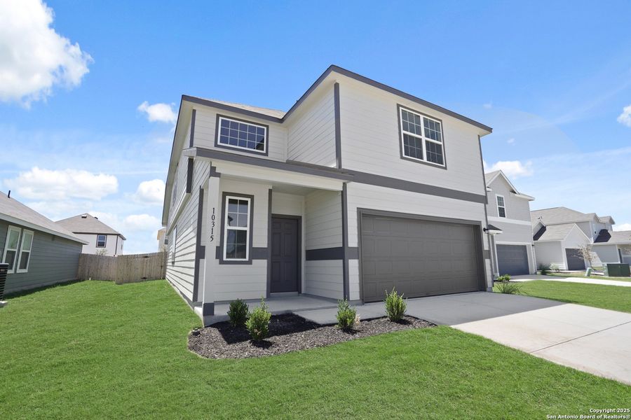 Front exterior of a new home in Applewhite Meadows, San Antonio, TX, highlighting curb appeal (Image 22). Front exterior of a new home in Applewhite Meadows, San Antonio, TX, highlighting curb appeal (Image 22).