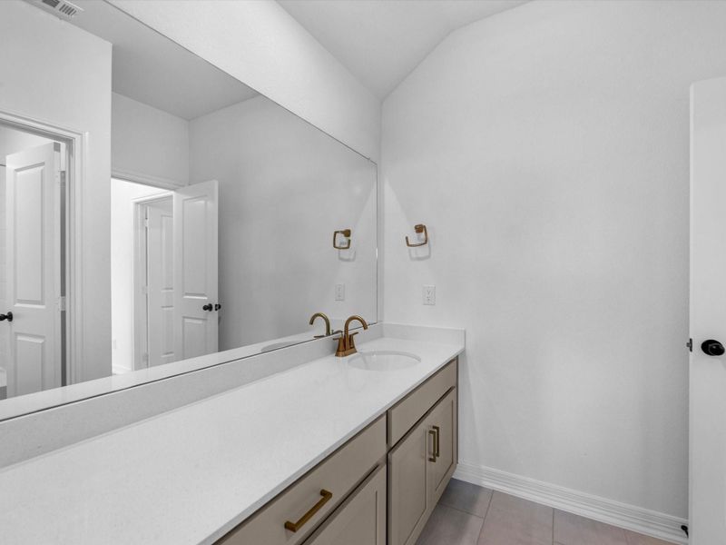 Furnished interior view inside a new home in Sunterra, Katy (Image 8).