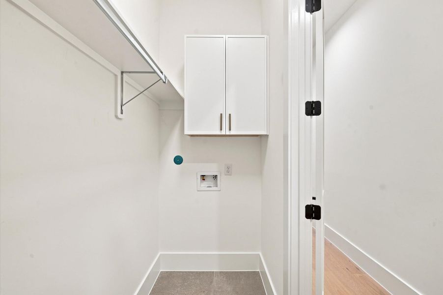 Laundry room is conveniently located on the second floor.