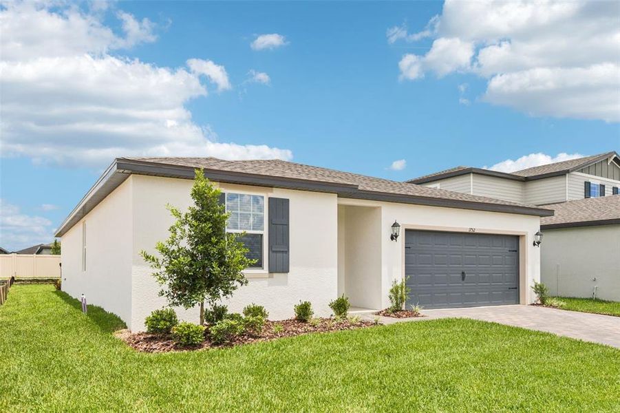 Front exterior of a new home in Two Rivers - Classic Series, Zephyrhills, FL, highlighting curb appeal (Image 16).