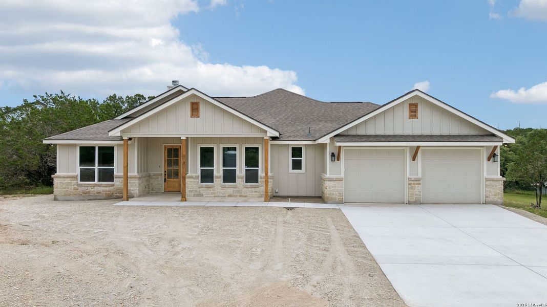 Front exterior of a new home in , Canyon Lake, TX, highlighting curb appeal (Image 18).
