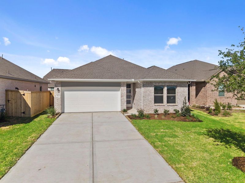 Front exterior of a new home in Windrose Green, Angleton, TX, highlighting curb appeal (Image 22).