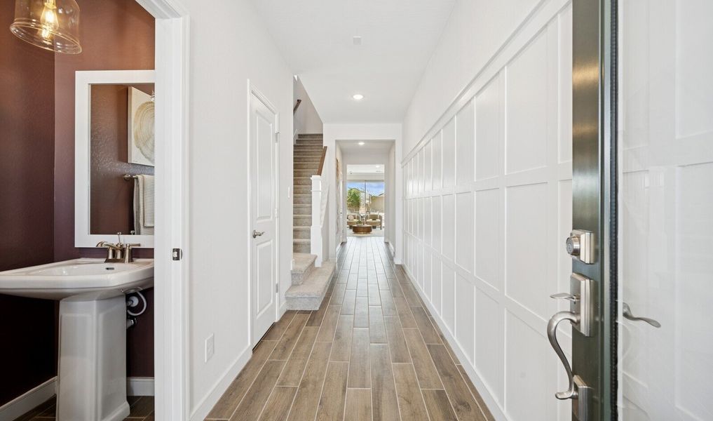 Welcoming foyer with decorative feature wall