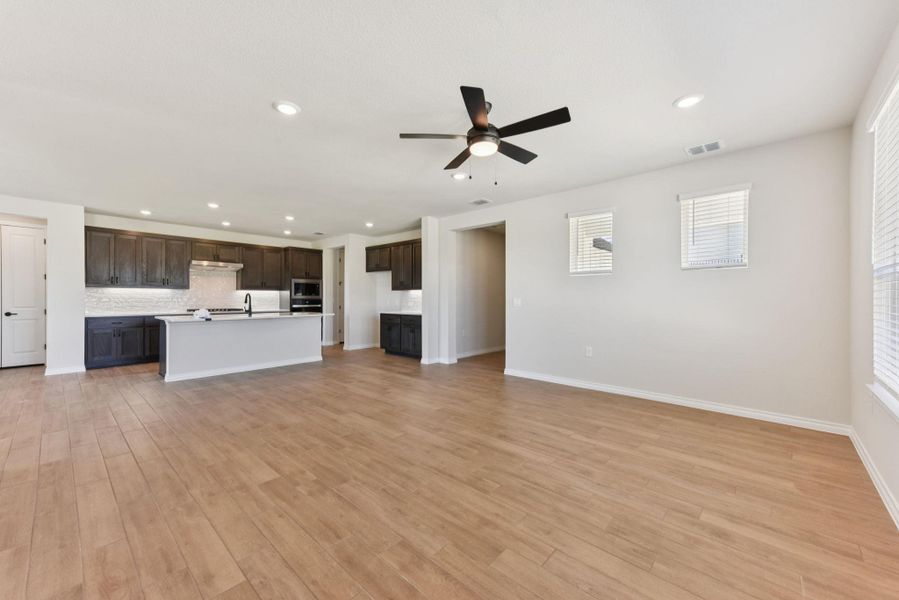 Unfurnished living room featuring recessed lighting, a ceiling fan, and light wood-type flooring