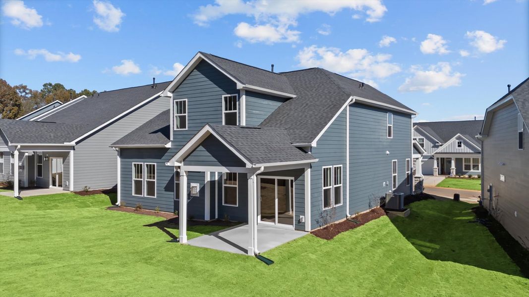 Tasteful rear porch provides a peaceful retreat and effortless indoor-outdoor flow Tasteful rear porch provides a peaceful retreat and effortless indoor-outdoor flow