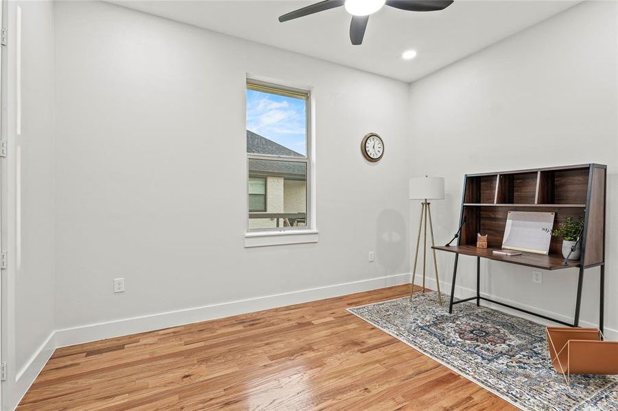 Office space featuring ceiling fan, wood finished floors, and recessed lighting Office space featuring ceiling fan, wood finished floors, and recessed lighting