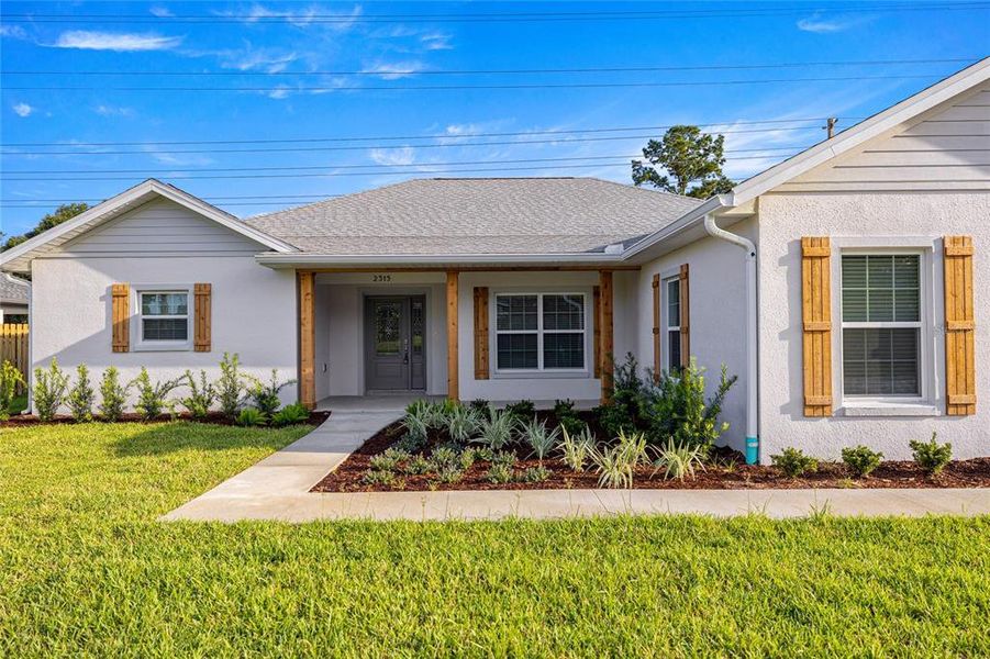 Front exterior of a new home in , Ocala, FL, highlighting curb appeal (Image 2).