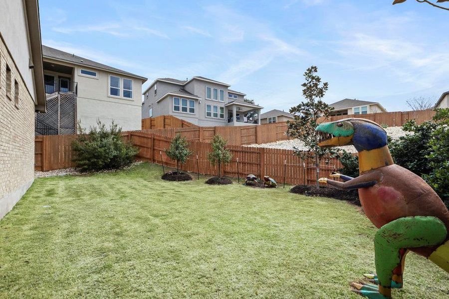 View of yard featuring a residential view and a fenced backyard