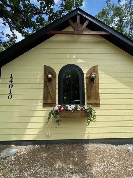 Exterior details and patio area of a home in , Log Cabin (Image 9).