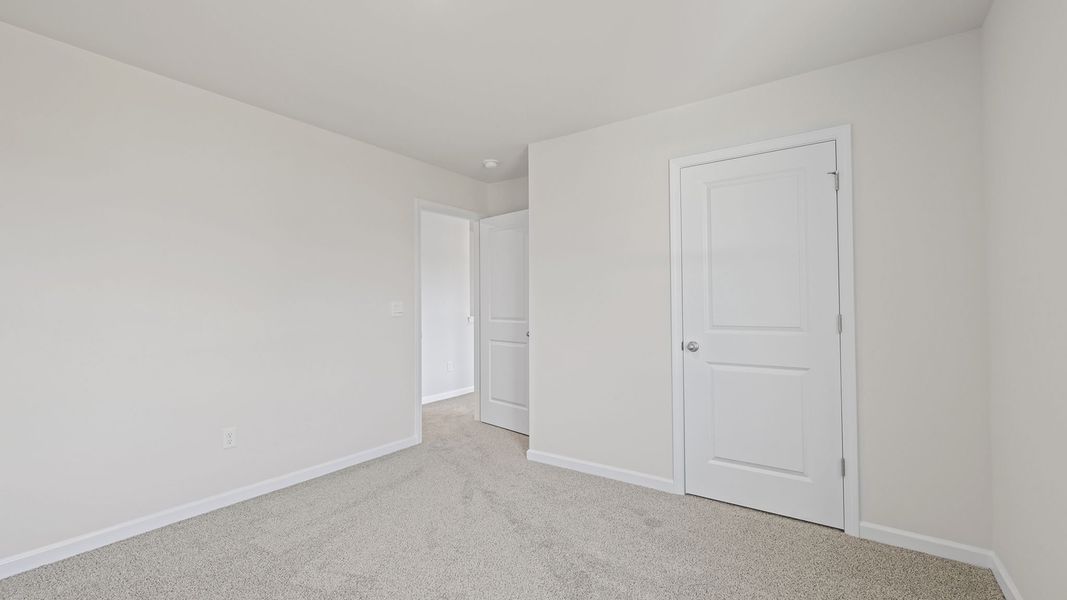 Spacious, unfurnished interior of a new home in Bentley Park, Greenwood (Image 24).