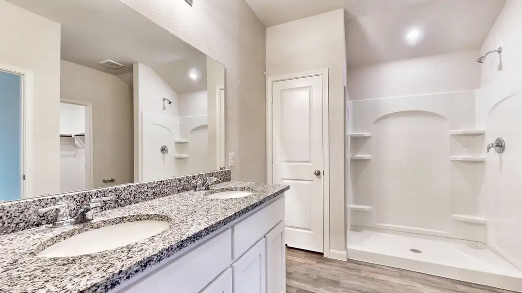 A bathroom with a marble countertop.