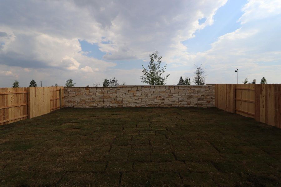 Front exterior of a new home in Flora, Hutto, TX, highlighting curb appeal (Image 20).