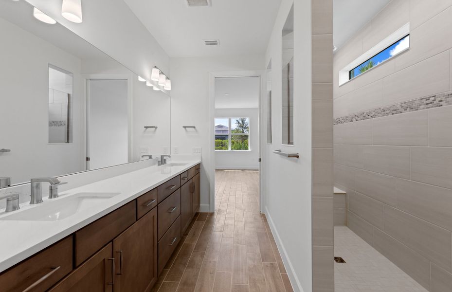 Owner's bathroom with dual-sink vanity and spacious shower
