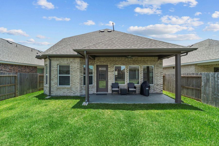 Covered back patio for year-round enjoyment Covered back patio for year-round enjoyment