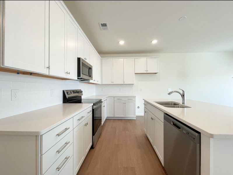 Furnished interior view inside a new home in Bellevue Townhomes, Greenville (Image 8).