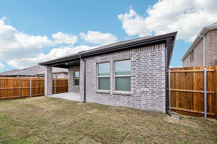 Exterior details and patio area of a home in Parks at Foster Crossing - Spring Series, Anna (Image 25).