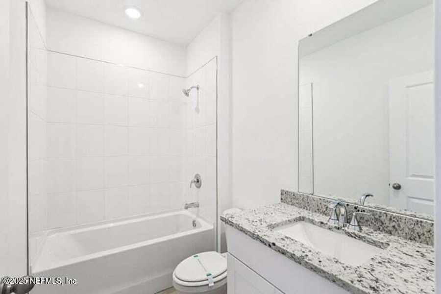 Furnished interior view inside a new home in Lakes at Bella Lago - Signature Series, Green Cove Springs (Image 6). Furnished interior view inside a new home in Lakes at Bella Lago - Signature Series, Green Cove Springs (Image 6).