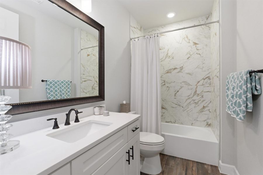 Bathroom off of the second bedroom with vanity with quarz countertops and tub/shower Bathroom off of the second bedroom with vanity with quarz countertops and tub/shower