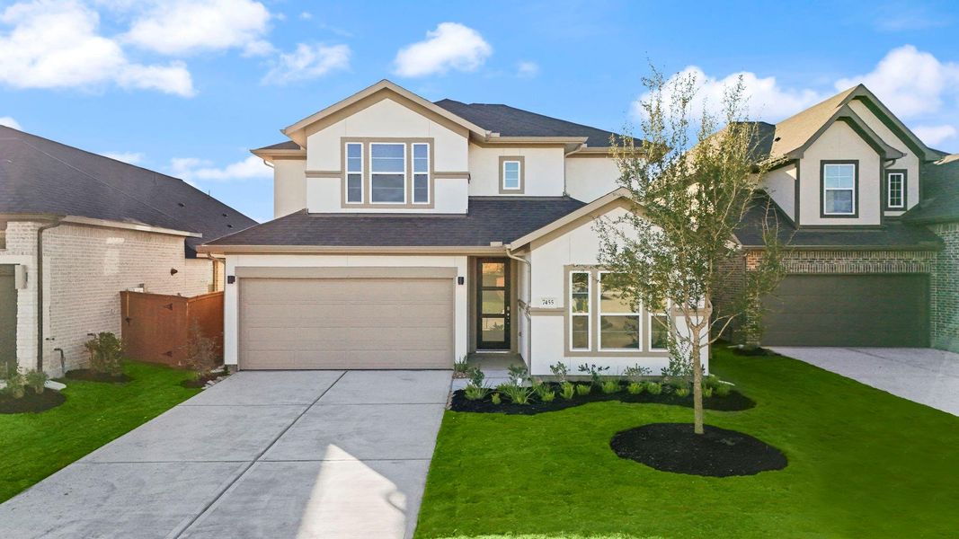 Front exterior of a new home in Elyson 45' & 70', Katy, TX, highlighting curb appeal (Image 16). Front exterior of a new home in Elyson 45' & 70', Katy, TX, highlighting curb appeal (Image 16).