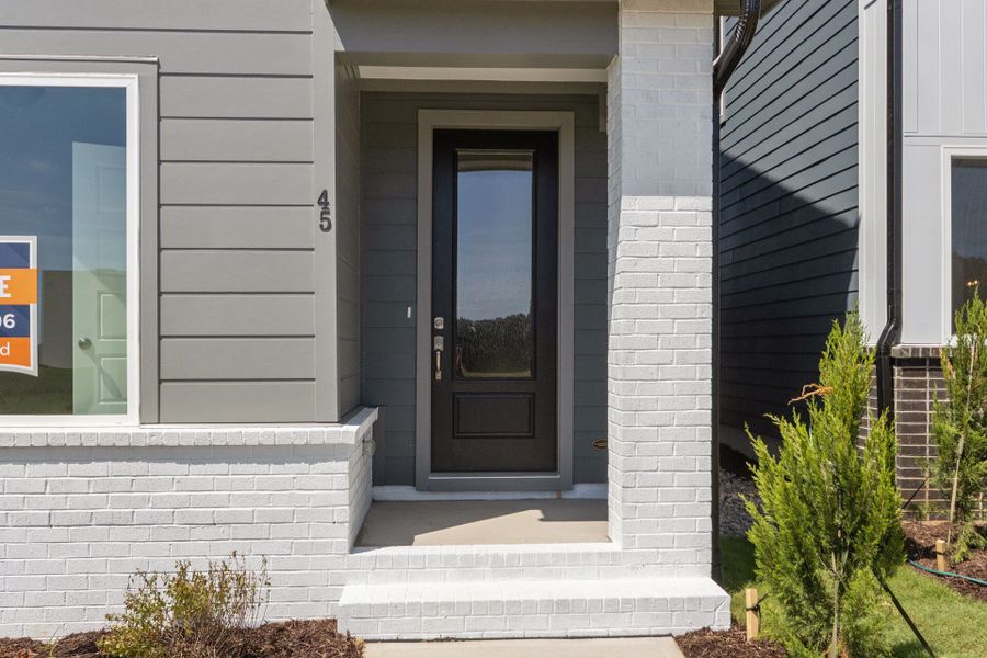 Exterior details and patio area of a home in NoVi Chatham Park - The Mews Collection, Pittsboro (Image 4). Exterior details and patio area of a home in NoVi Chatham Park - The Mews Collection, Pittsboro (Image 4).