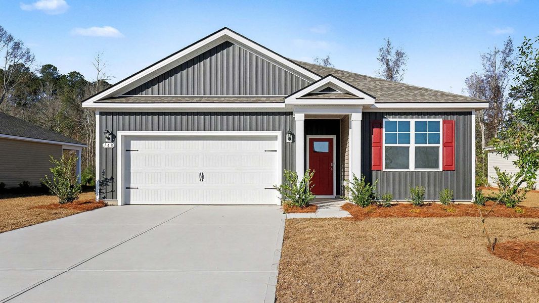 Front exterior of a new home in Pinewood Estates, Conway, SC, highlighting curb appeal (Image 1). Front exterior of a new home in Pinewood Estates, Conway, SC, highlighting curb appeal (Image 1).