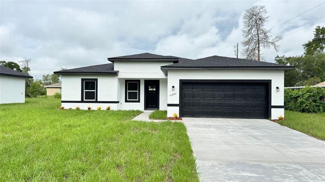 Front exterior of a new home in , Ocala, FL, highlighting curb appeal (Image 1). Front exterior of a new home in , Ocala, FL, highlighting curb appeal (Image 1).
