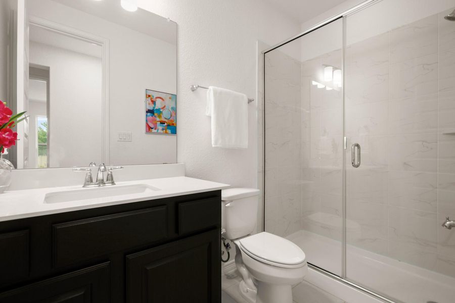 The full main floor guest bath is conveniently located across from the guest bedroom. The full main floor guest bath is conveniently located across from the guest bedroom.