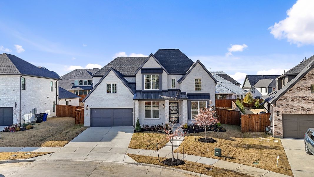 Front exterior of a new home in Estates at Rockhill, Frisco, TX, highlighting curb appeal (Image 27). Front exterior of a new home in Estates at Rockhill, Frisco, TX, highlighting curb appeal (Image 27).