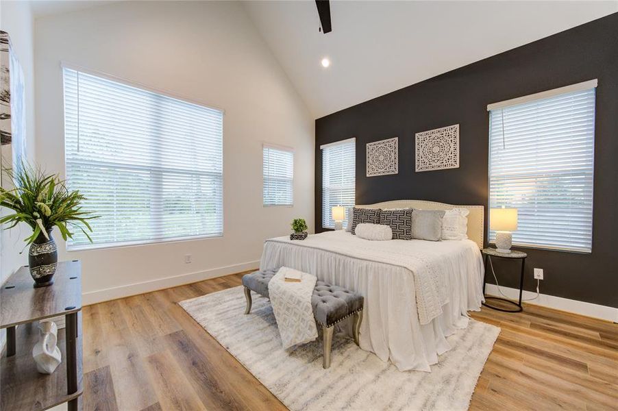 Primary Bedroom. Features cathedral ceilings, lots of windows for natural light and a large walk-in closet.