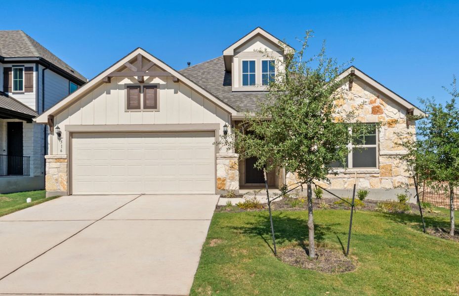 Front exterior of a new home in Saddleback at Santa Rita Ranch, Liberty Hill, TX, highlighting curb appeal (Image 1). Front exterior of a new home in Saddleback at Santa Rita Ranch, Liberty Hill, TX, highlighting curb appeal (Image 1).