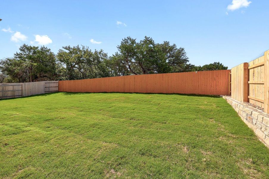 Exterior details and patio area of a home in Lariat, Liberty Hill (Image 14).