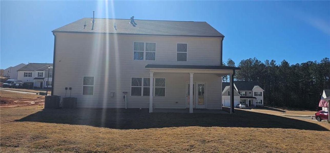 Front exterior of a new home in Stillwater Springs, Dacula, GA, highlighting curb appeal (Image 18).