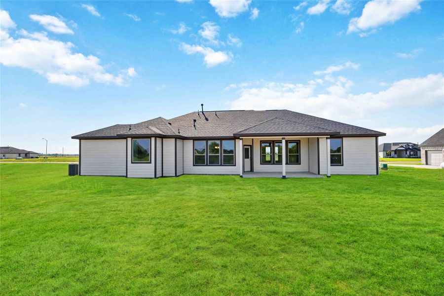 Enjoy outdoor living with an extended covered patio and a three-car garage to suit your needs.