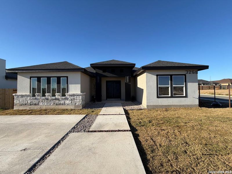 Front exterior of a new home in , Eagle Pass, TX, highlighting curb appeal (Image 14). Front exterior of a new home in , Eagle Pass, TX, highlighting curb appeal (Image 14).