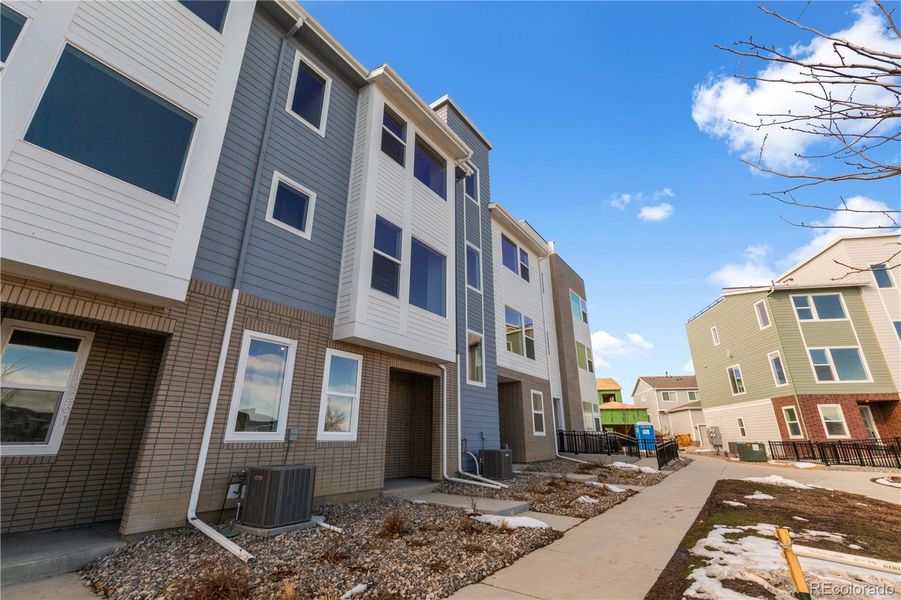 Front exterior of a new home in Dillon Pointe - Skyview, Broomfield, CO, highlighting curb appeal (Image 15).