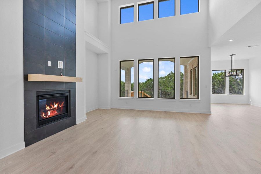 Family Room with soaring ceiling & fireplace