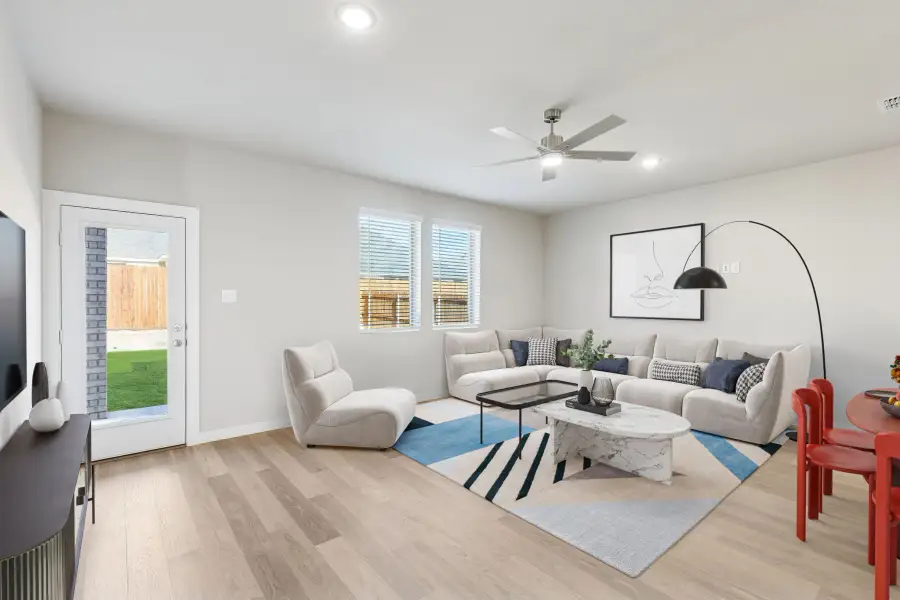 Living Room in the Haylee home plan by Trophy Signature Homes - REPRESENTATIVE PHOTO