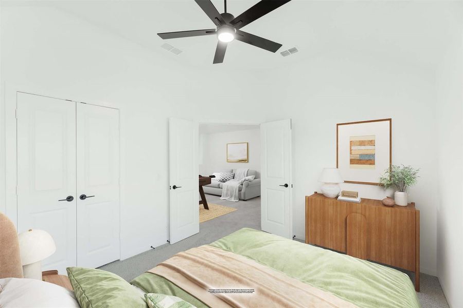 Bedroom with ceiling fan, double closet doors, wood dresser, and open doorway to sitting room Bedroom with ceiling fan, double closet doors, wood dresser, and open doorway to sitting room