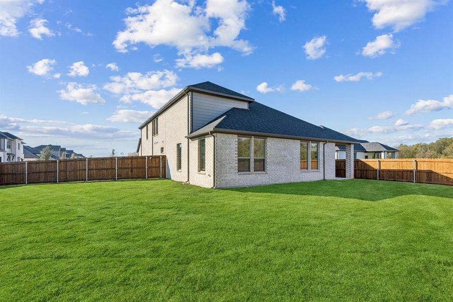 Covered Patio in the Wimbledon home plan by Trophy Signature Homes – REPRESENTATIVE PHOTO