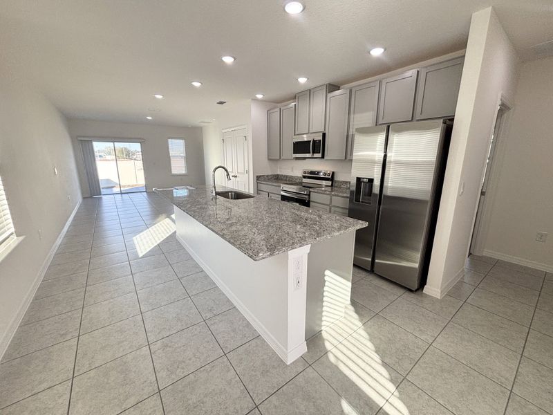 Furnished interior view inside a new home in Lake Deer Estates, Poinciana (Image 5).