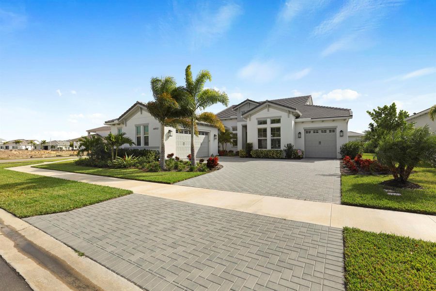 Front exterior of a new home in , Westlake, FL, highlighting curb appeal (Image 26).
