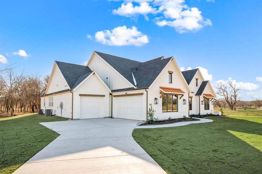 Front exterior of a new home in Rolling Creek Ranch, Aledo, TX, highlighting curb appeal (Image 2). Front exterior of a new home in Rolling Creek Ranch, Aledo, TX, highlighting curb appeal (Image 2).