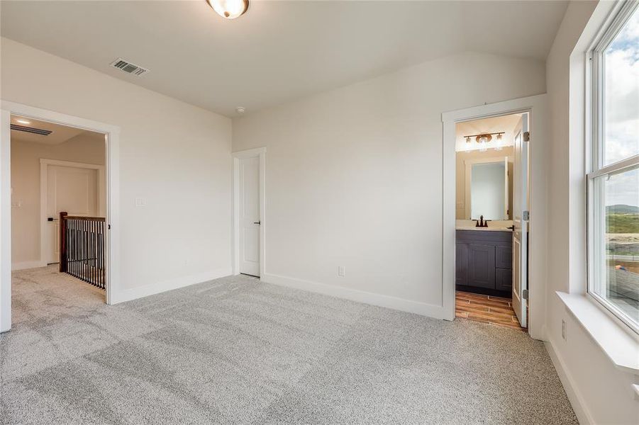 Another secondary bedroom has it's own full bathroom attached.