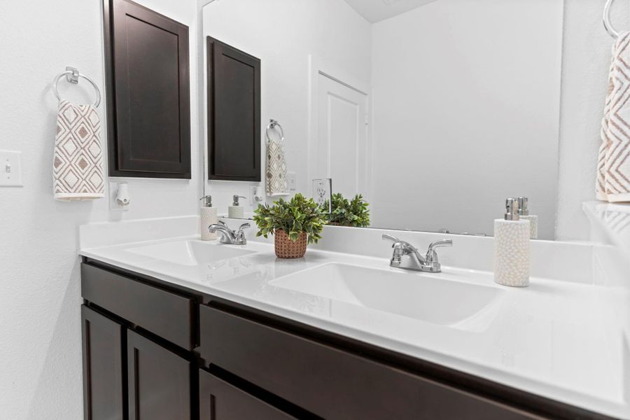 Another view of the primary bath highlights the extended vanity space, under-mounted sinks, and spa-like finishes that elevate everyday routines. **Image Representative of Plan Only and May Vary as Built**.