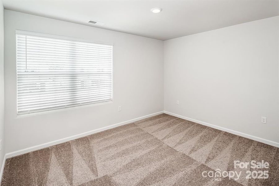 Spacious, unfurnished interior of a new home in McKee Creek Village, Charlotte (Image 11).